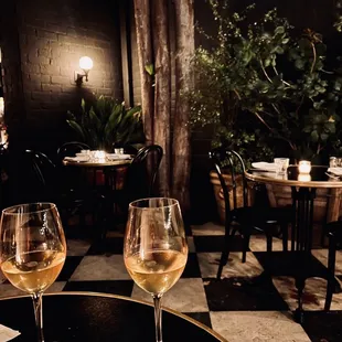 two glasses of wine on a table