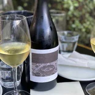 a bottle of wine and two glasses of wine