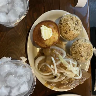 Smothered chicken, dirty rice and a muffin