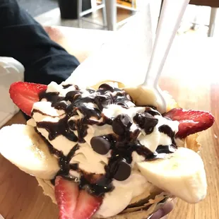 a hand holding a dessert
