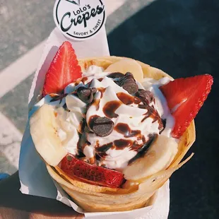 a hand holding a dessert