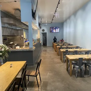 a long dining area with tables and chairs