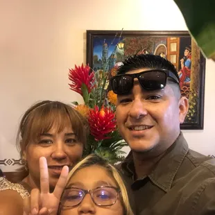 a man and two women posing for a picture