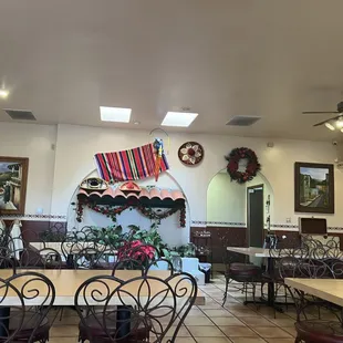 a dining area with tables and chairs