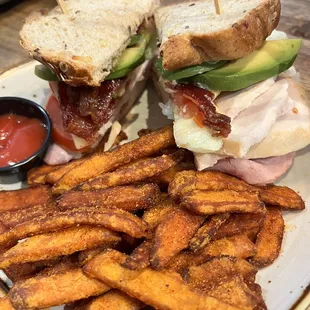 Turkey bacon club sandwich with sweet potato fries! So yummy! Sandwich was massive