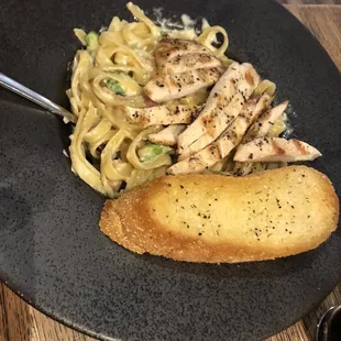 a plate of pasta and chicken