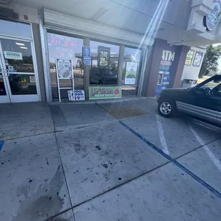 a car parked in front of the store