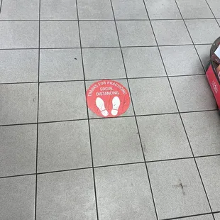 a box of pizza on the ground