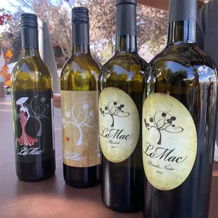 three bottles of wine on a table