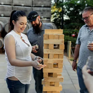 a woman playing a game of jenga