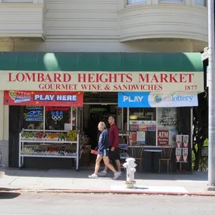 two people walking down the sidewalk