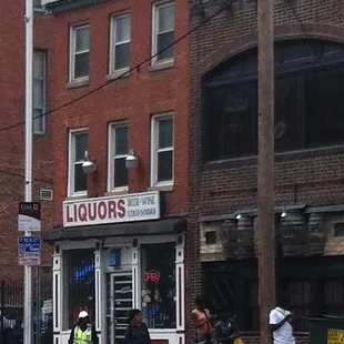 a group of people walking down the street