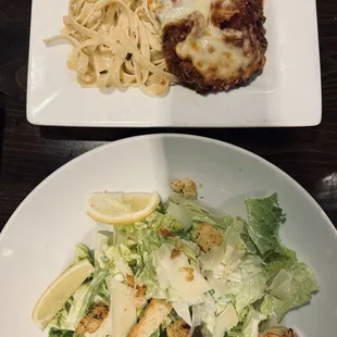 Chicken parmesan and Ceaser salad with prawn