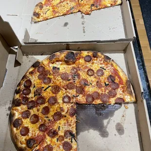 What was left by the time I got home. Bar pie on top and pepperoni on bottom.