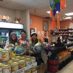 two women standing in front of the counter