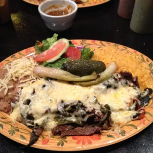 I forgot what it was called that hubby ordered but it was good. Beef strips cooked w jalapeños and veggies, drenched in cheese.