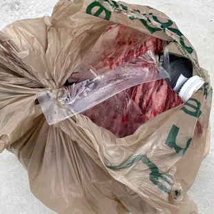 Rotten meat in my trash.