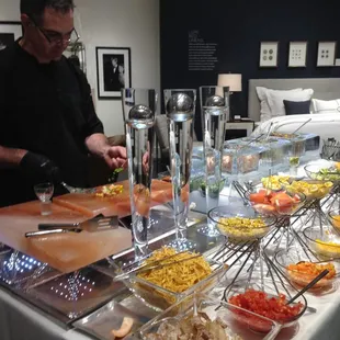 Ceviche Bar at the Mitchell Gold + Bob Williams Home Furnishings Store Opening Event with someone making ceviche