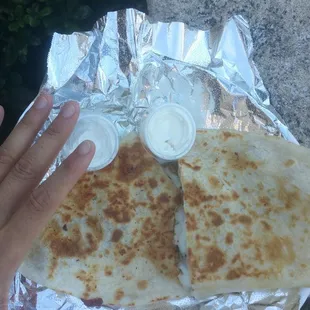 Massive asada quesadilla. Hand for scale, and to grab and eat!