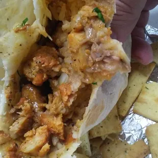Hella good chicken burrito.  Do mind they pita chips in the background.