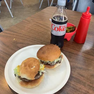 2 hamburger with mustard and lettuce.