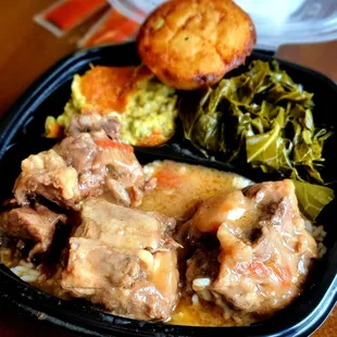 Braised Oxtail over rice with gravy, broccoli casserole, collards, and a jalapeno corn muffin, $19.95. Mmmmm.