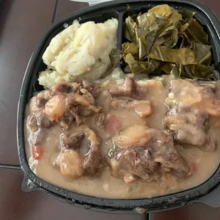 Ox tails , greens and potatoes