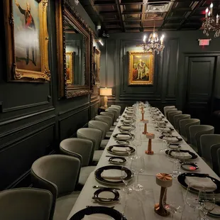 a long table set for a formal dinner