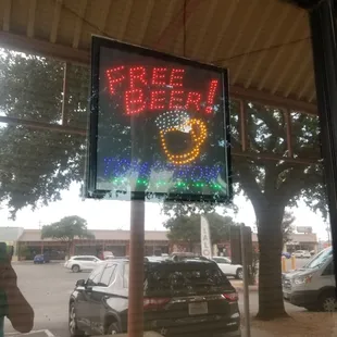 a neon sign for a beer shop