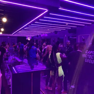 a large group of people in a nightclub