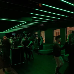 a group of people at a bar