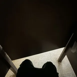 The bathroom stall door doesn't afford as much privacy as you might like! That's just at knee height.