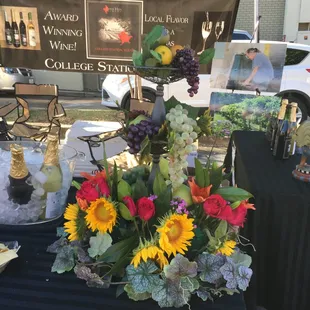 a display of wine and flowers