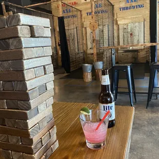 a table with a drink and a stack of bricks
