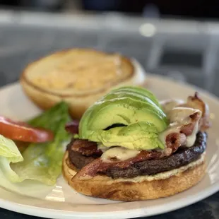 a plate with a burger and a salad