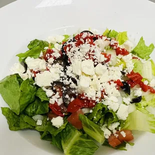 a salad with feta cheese and olives