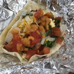 Bacon taco with everything except jalapeño. Love their red salsa!