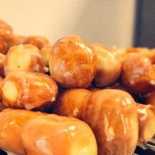 a pile of glazed donuts