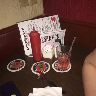 a table with drinks and menus