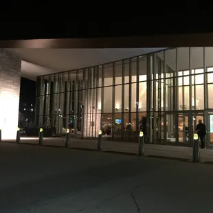 people walking in front of the building
