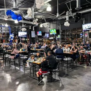 a large group of people sitting at tables