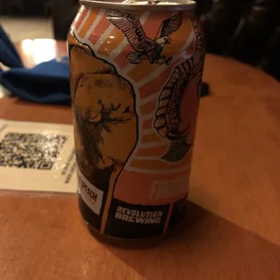 a can of beer on a table