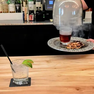 a bartender serving a drink