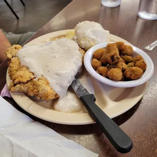 Chicken fried steak, fried okra, mashed potatoes.