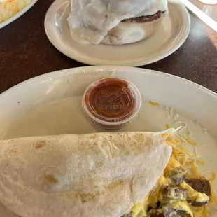a breakfast burrito and a breakfast sandwich