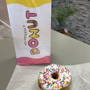 a single donut with sprinkles