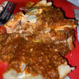 Burger smothered in chili