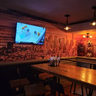 a large screen tv in the background