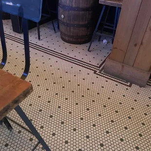 a wooden barrel on the floor