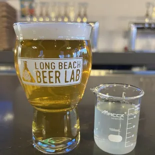 a glass of beer and a beaker